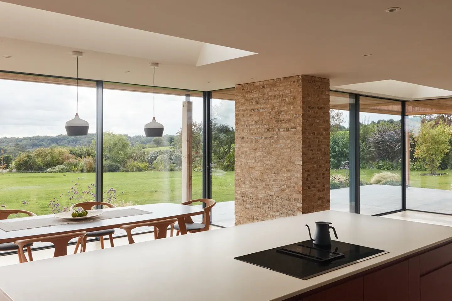 Garden facing kitchen using Caesarstone Fresh Concrete work surfaces