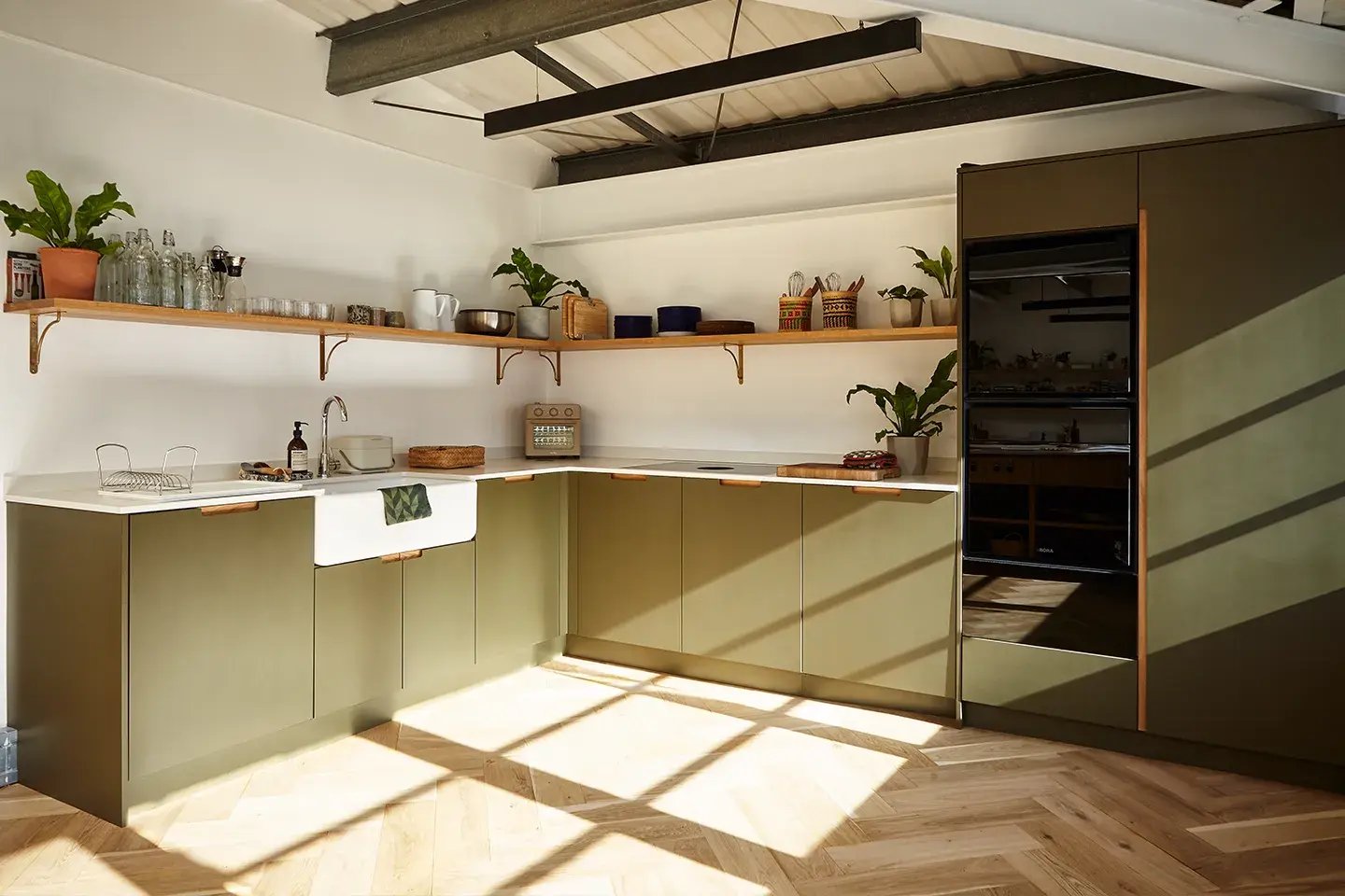 Caesarstone Cloudburst Concrete in olive green kitchen