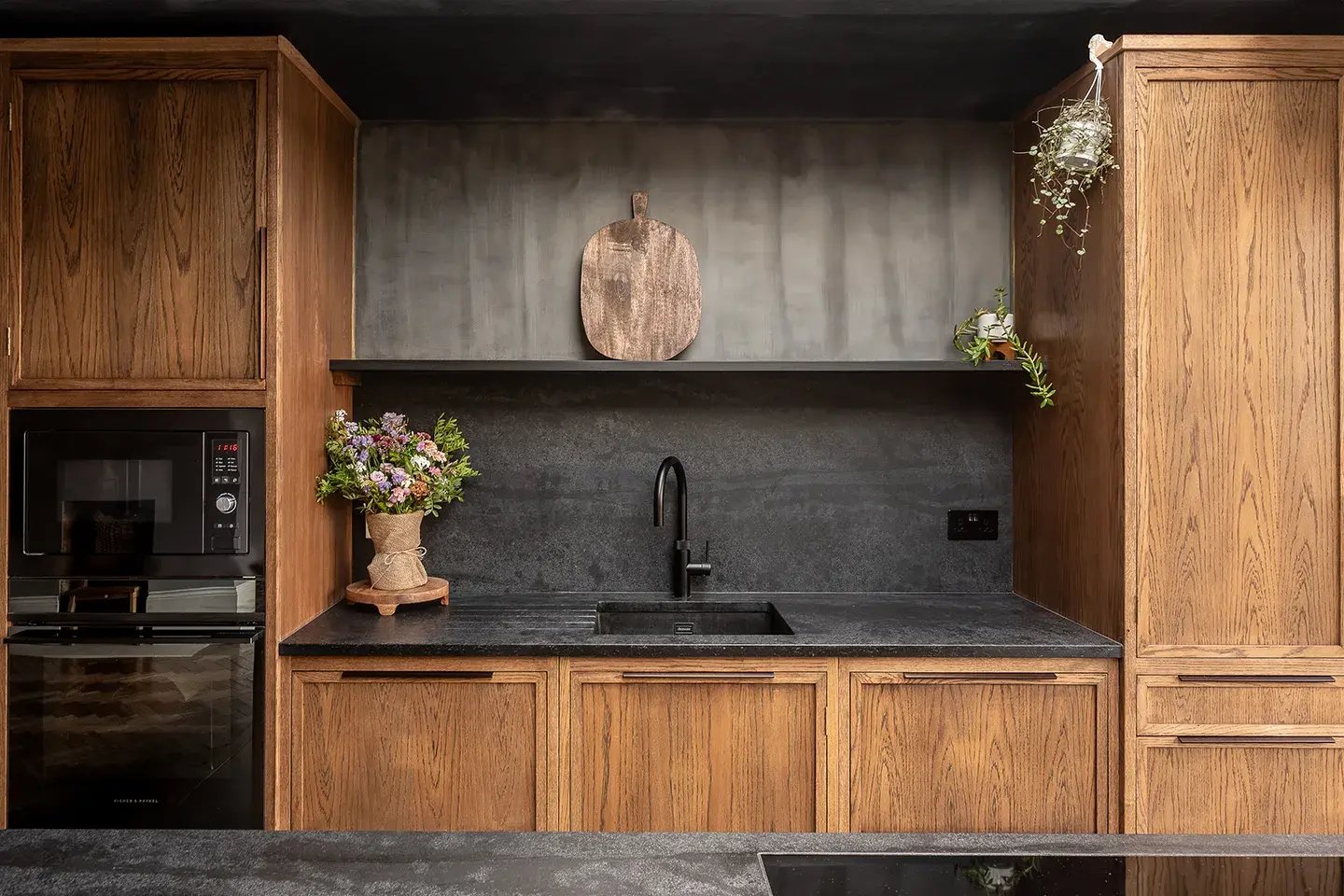 Close-up of Caesarstone Black Tempal Mineral Worktop and Backsplash