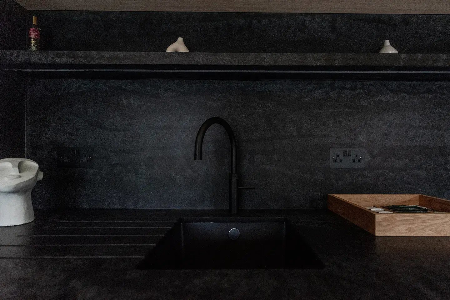 Close-up of Caesarstone Black Tempal kitchen worktop and splashback