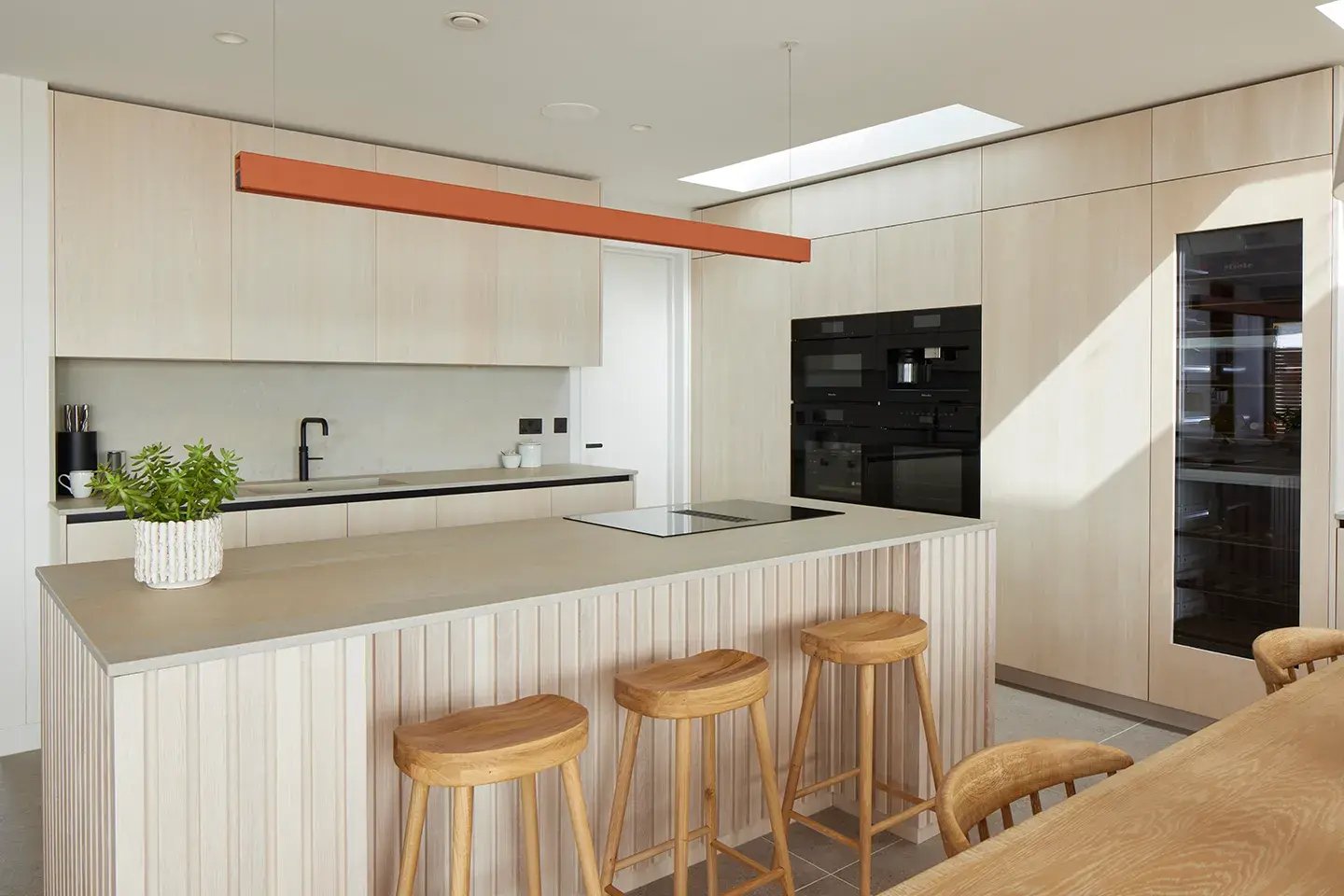 Coastal kitchen featuring Caesarstone Primordia worktops and kitchen island