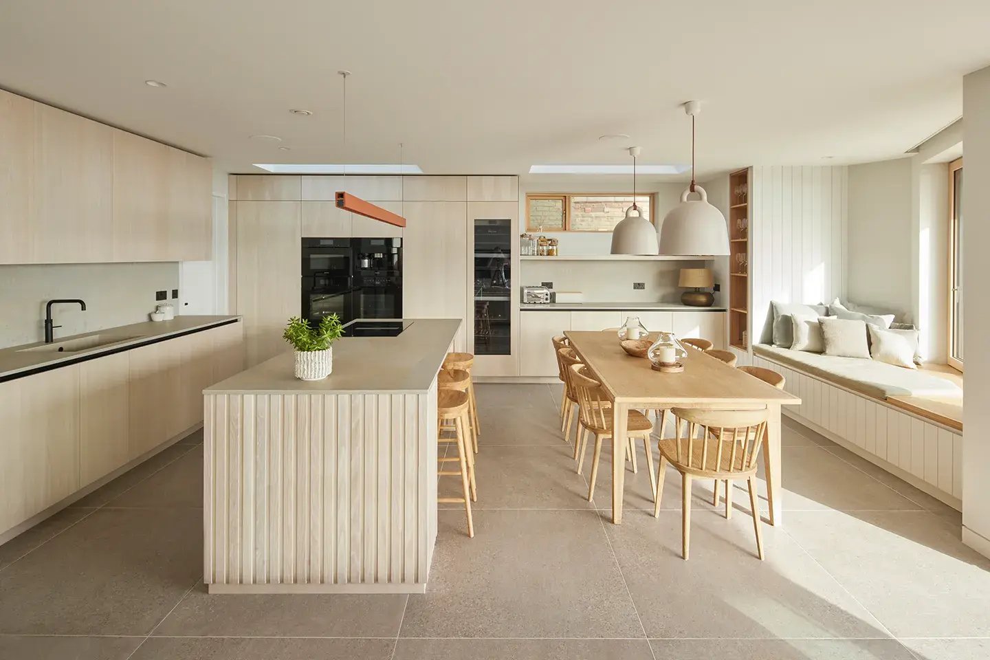Open-plan kitchen-diner with Caesarstone Primordia worktop surfaces
