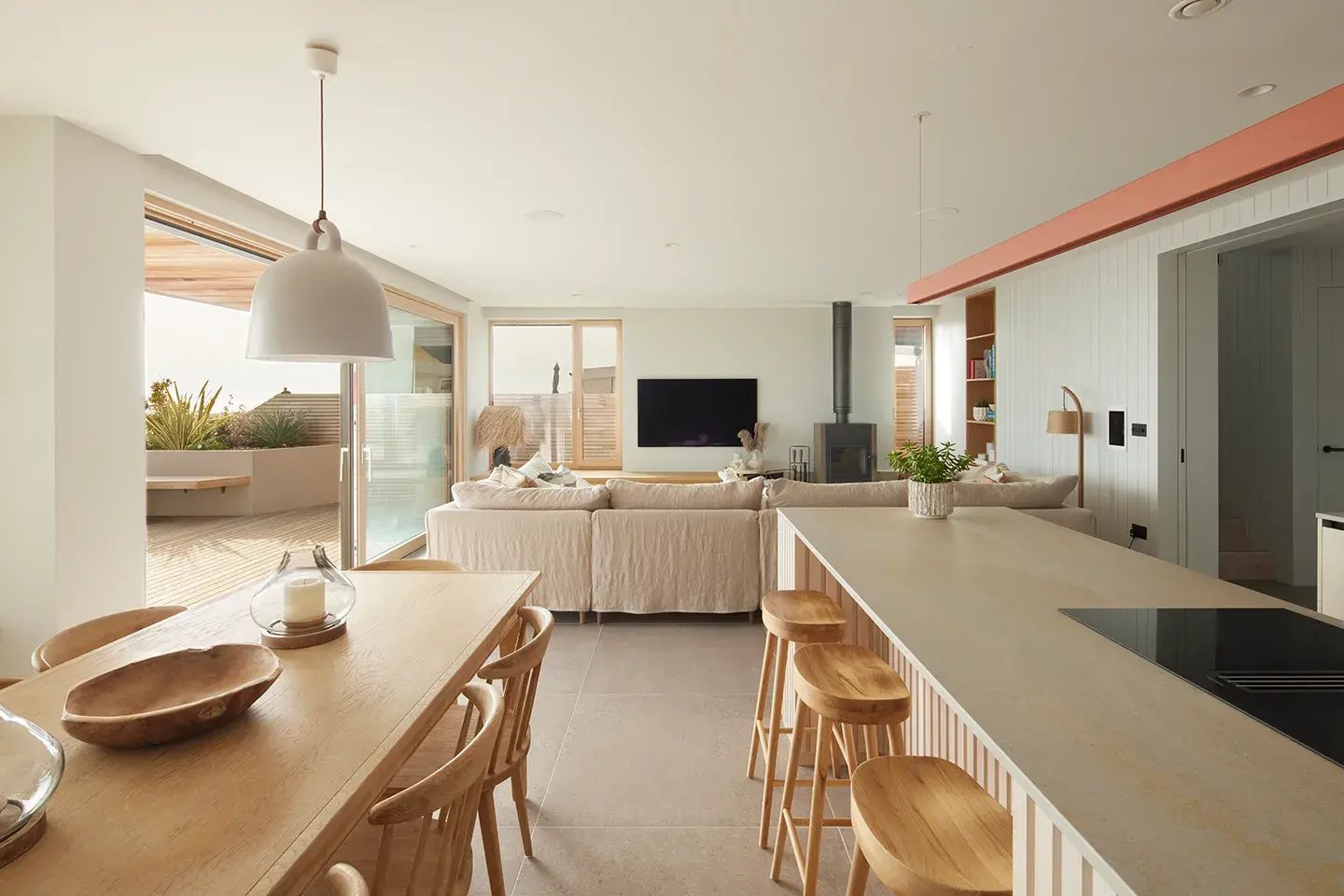 Modern open-plan Scandi kitchen with Caesarstone Primordia worktop surfaces and island