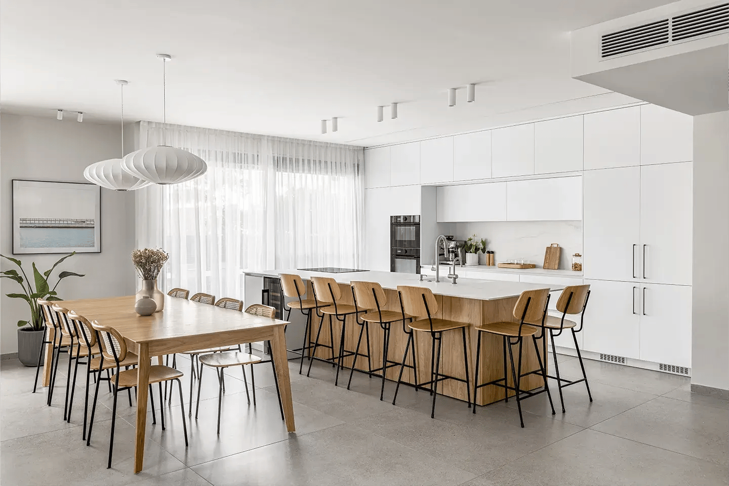 Contemporary kitchen featuring Caesarstone Snowdrift porcelain island and backsplash