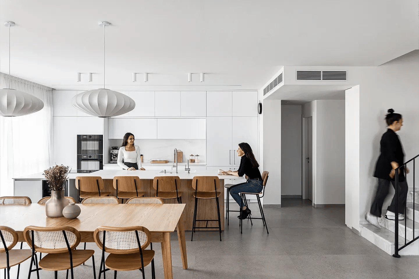 Modern kitchen with Caesarstone 501 Snowdrift kitchen island and worktops