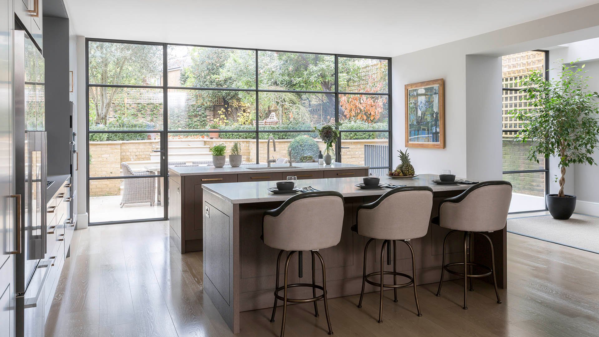 Garden facing kitchen complete with Caesarstone Bianco Drift quartz worktops