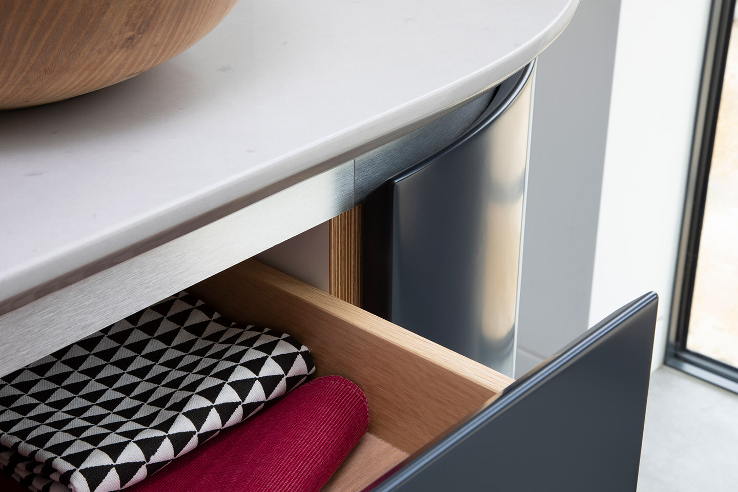 Close-up of Caesarstone Misty Carrera quartz kitchen island