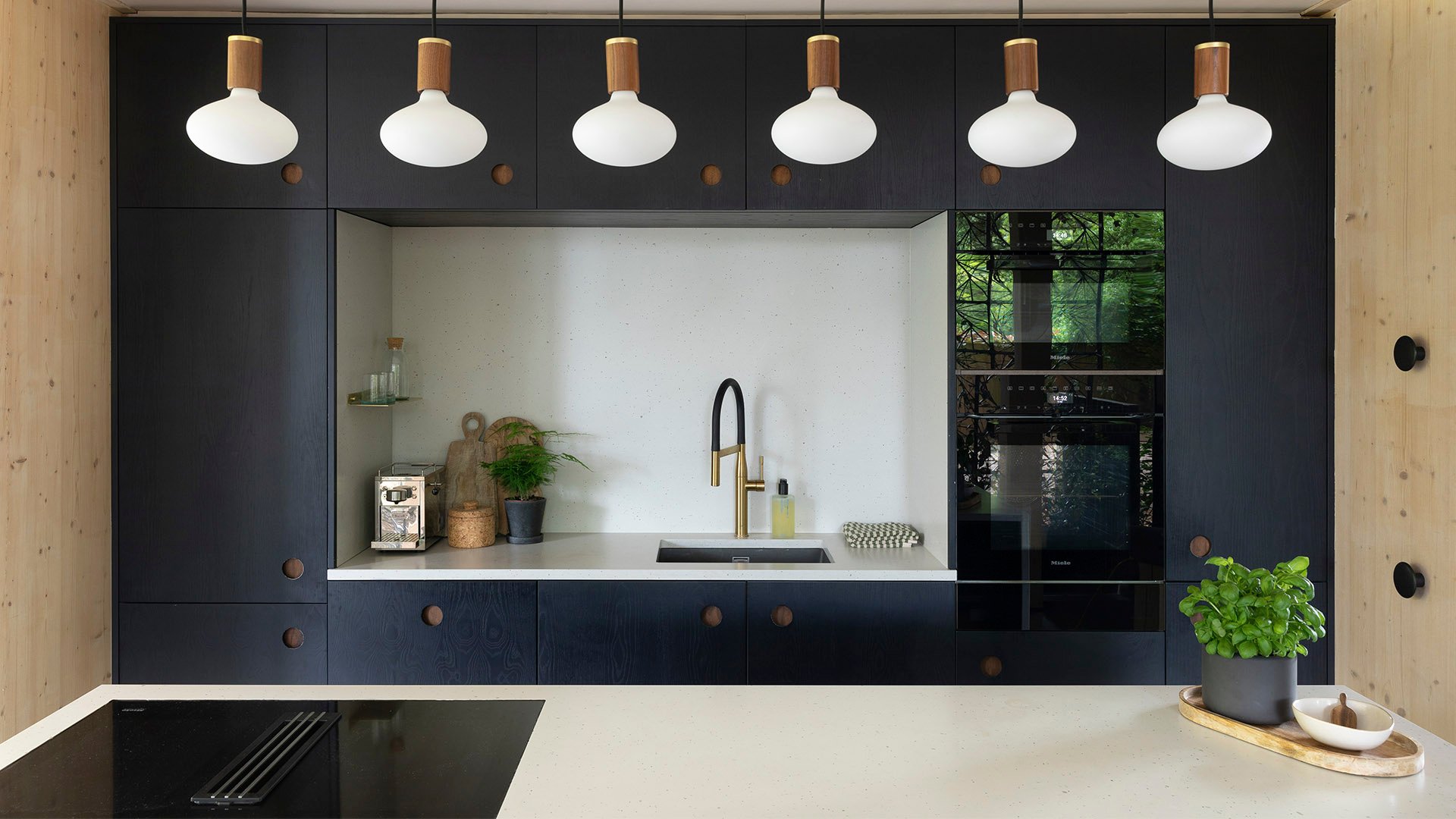 Close-up of Caesarstone Frozen Terra quartz kitchen island and worktops