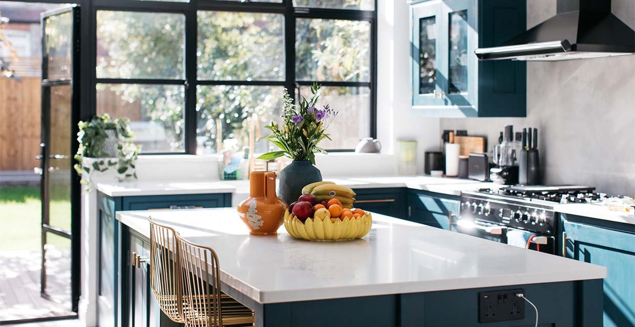 white kitchen worktop and dark blue cabinets