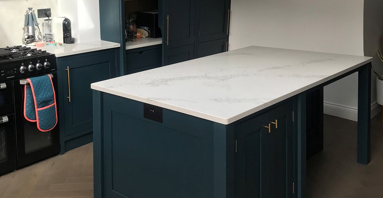 white kitchen worktops and blue cabinets