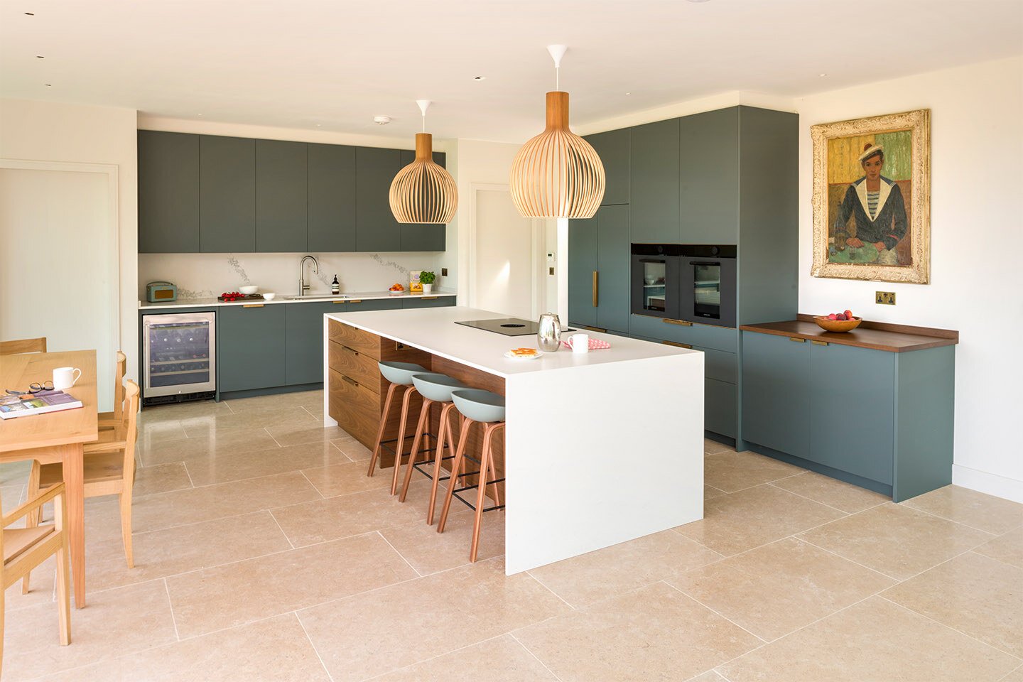 Caesarstone Fresh Concrete Island and Statuario Maximus worktops in a modern kitchen