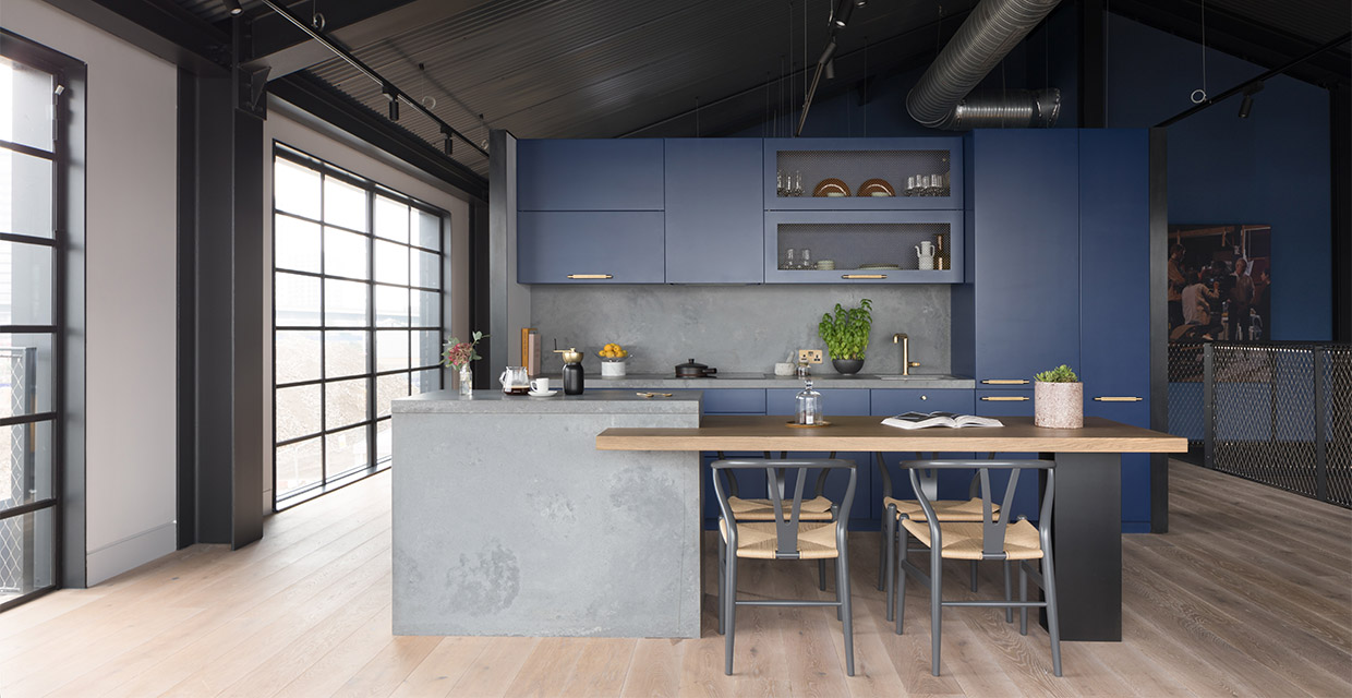 concrete worktops in blue kitchen