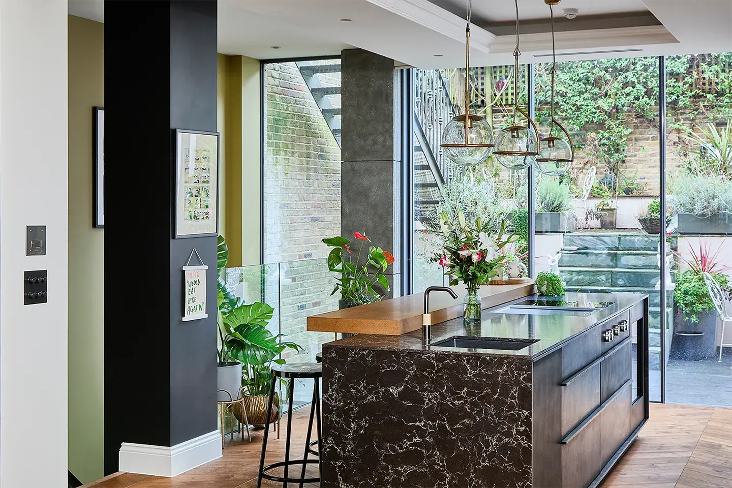 Family kitchen with a Caesarstone 6338 Woodlands kitchen island