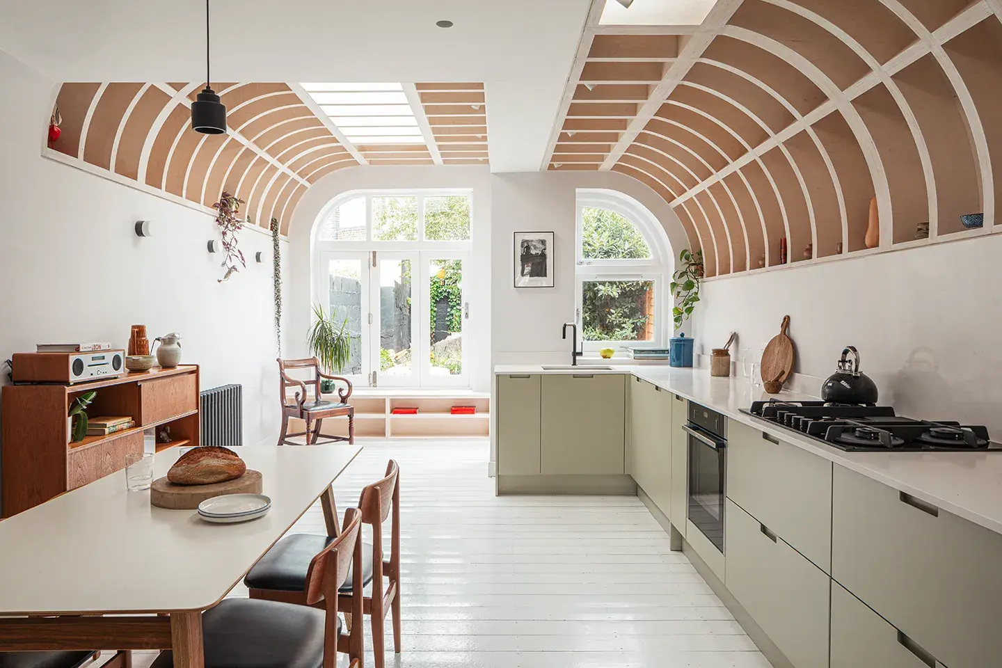 Caesarstone Frosty Carrina worktops in a vaulted kitchen specified by ROAD architecture studio